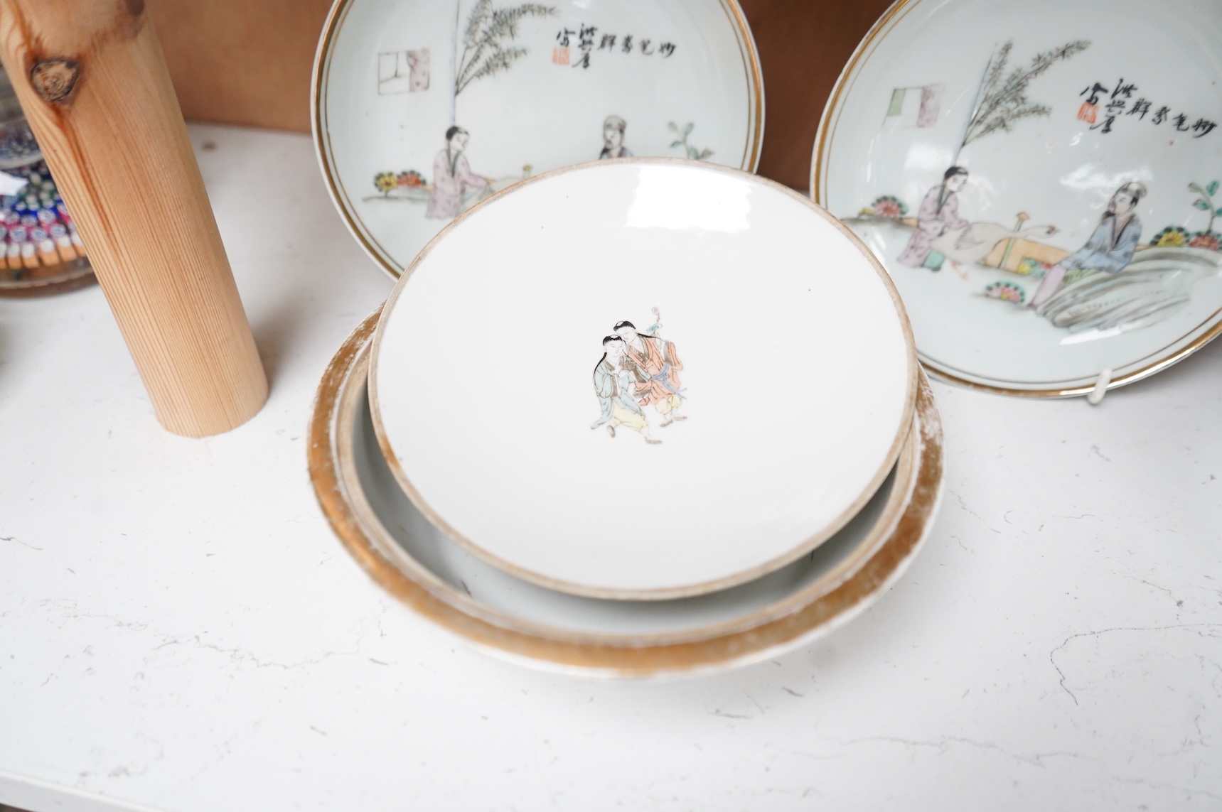 A Chinese Republic period famille rose stacking box, two dishes and a bowl and cover, largest 14cm